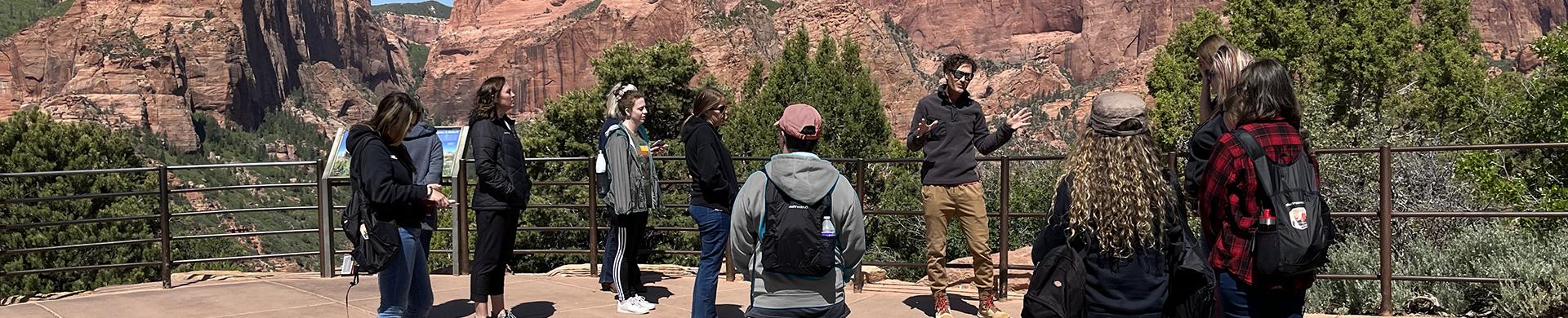 Tour Guide leading a group of participants in Zion National Park